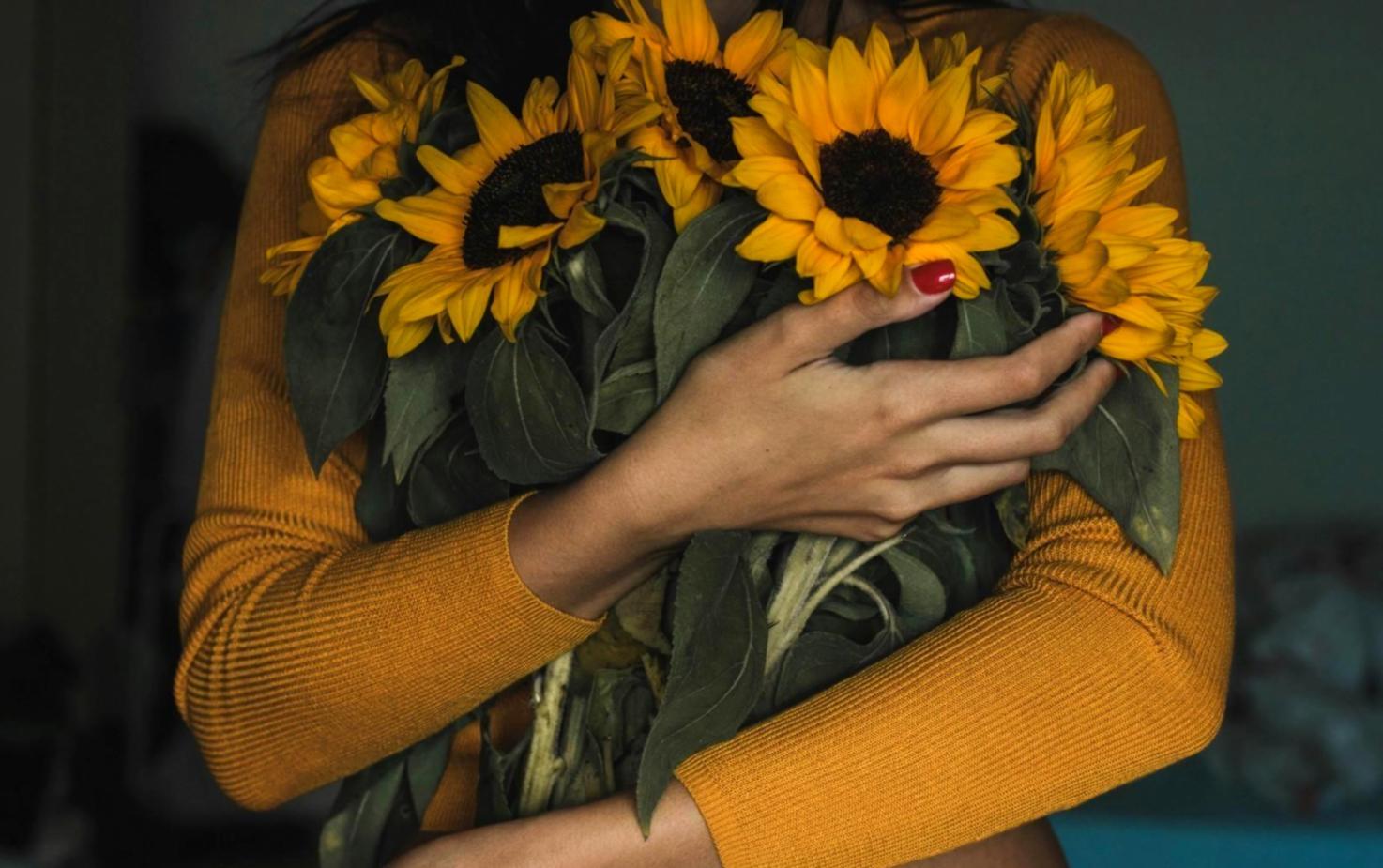 Professional floristry workshop showing students creating seasonal arrangements