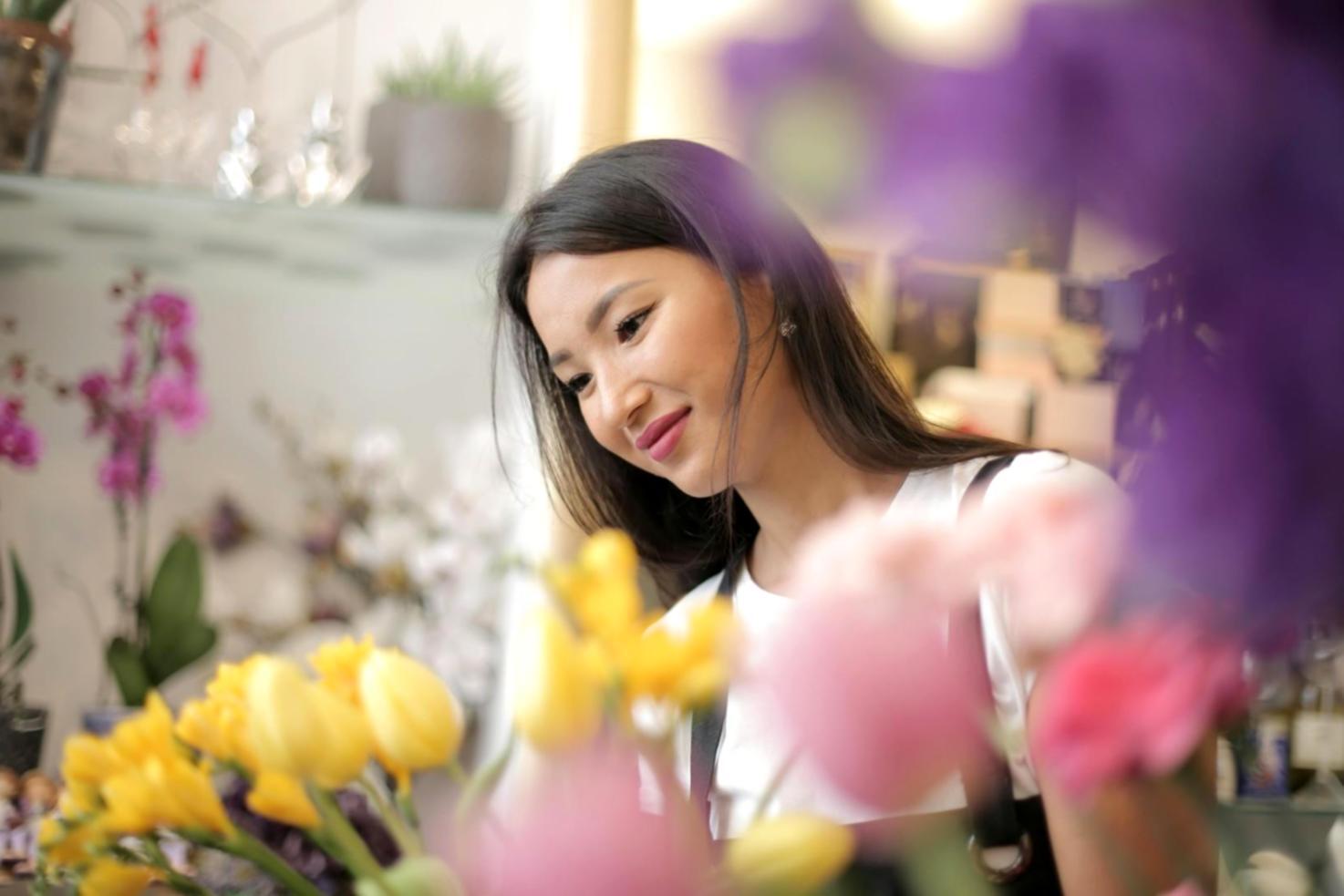 Students practicing floral arrangement techniques during hands-on workshop session